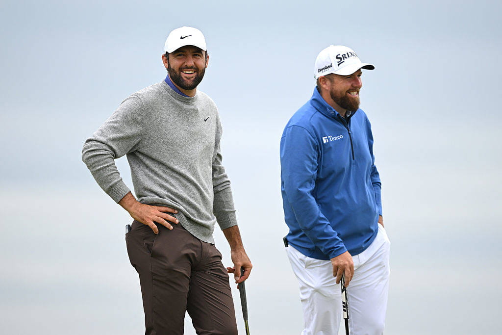 Scottie Scheffler and Shane Lowry during round one at Royal Portrush